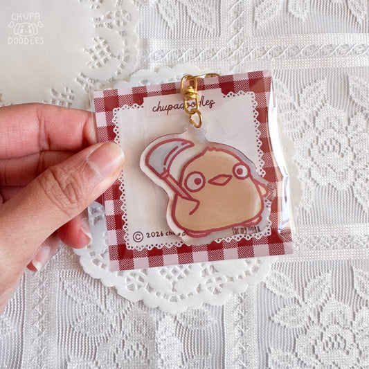 Duck with scythe epoxy keychain close up, glossy double-sided charm