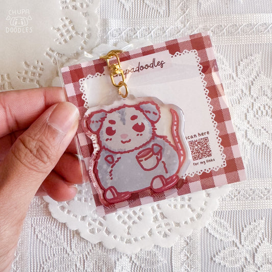 Possum epoxy keychain close up, glossy double-sided charm