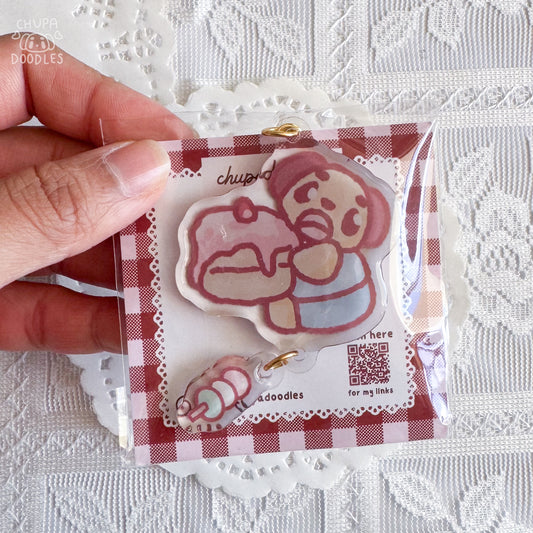 Chupa double charm keychain close up, double-sided epoxy cake and mochi charm
