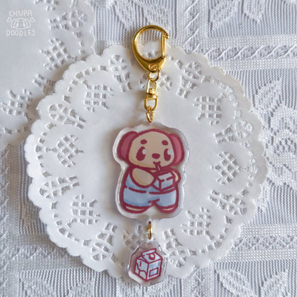 Chupa epoxy keychain with size reference, two charms on a gold-tone clasp