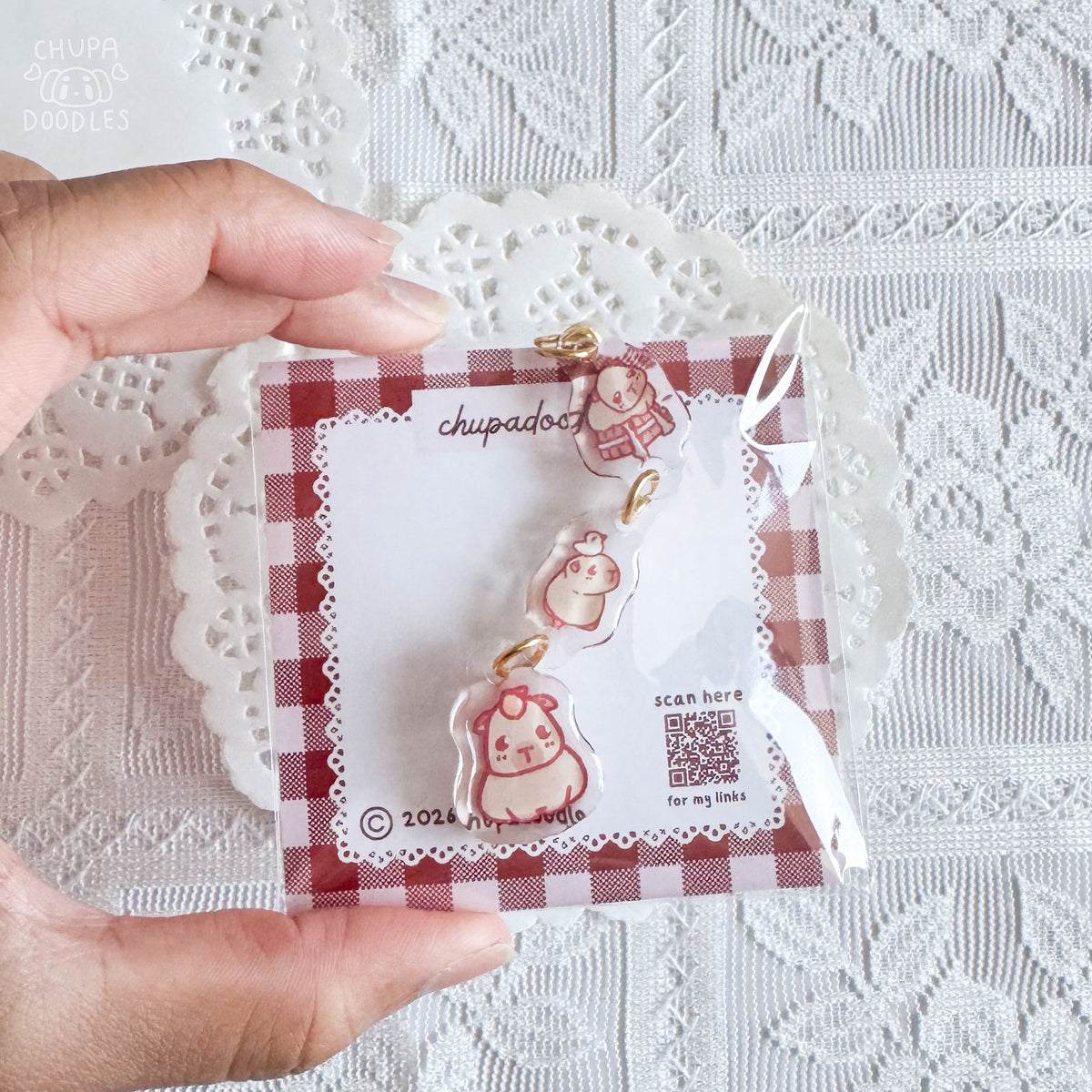 Capybara epoxy keychain close up, double-sided three-charm bag charm