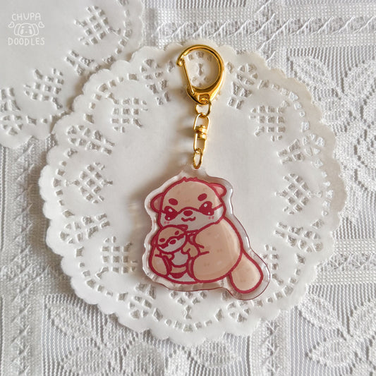 Otter epoxy keychain close up, glossy double-sided charm