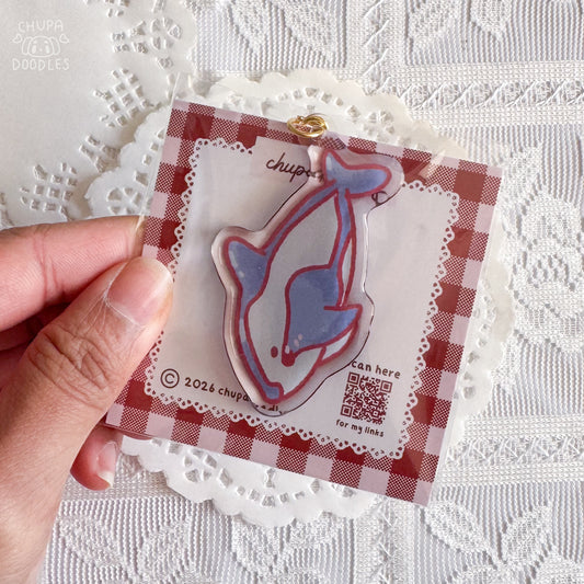Whale epoxy keychain close up, glossy double-sided charm