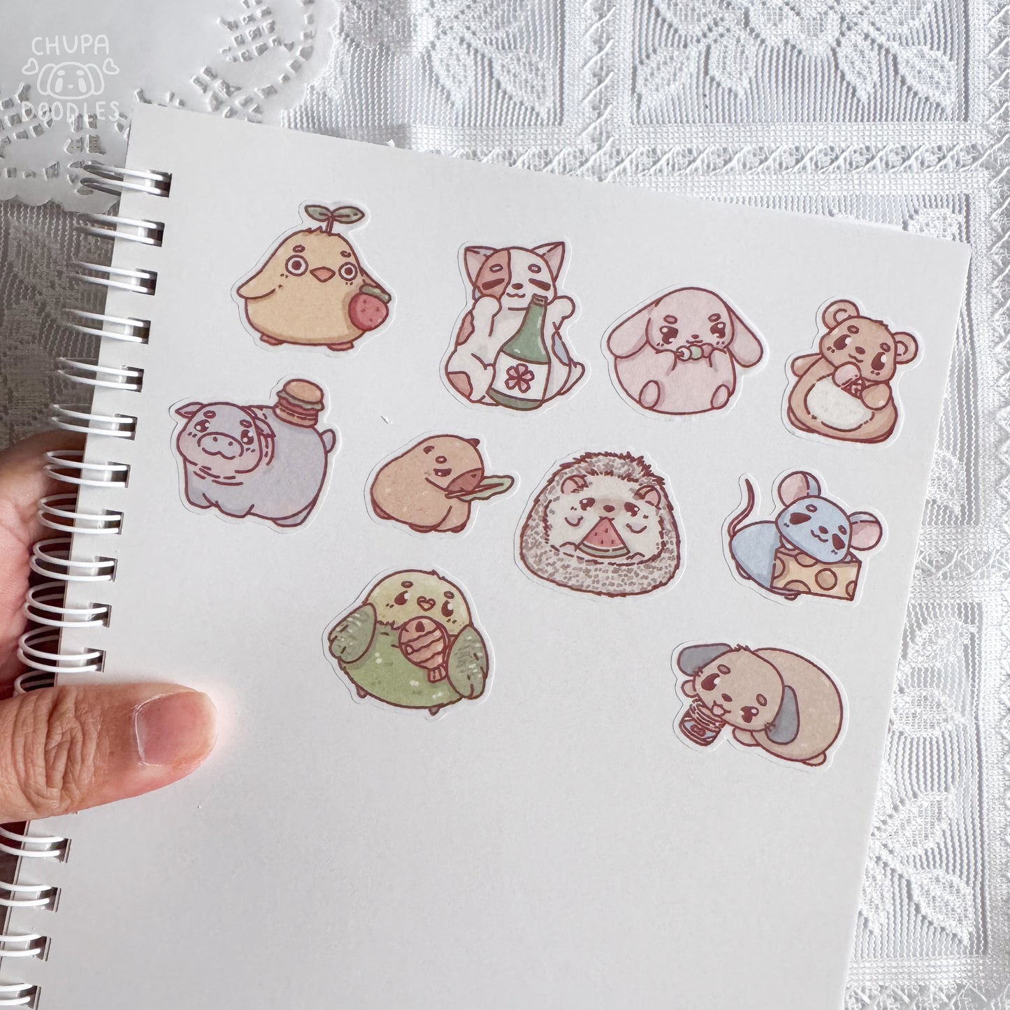 Chunky animals and food sticker sheet close up, round animals eating snacks
